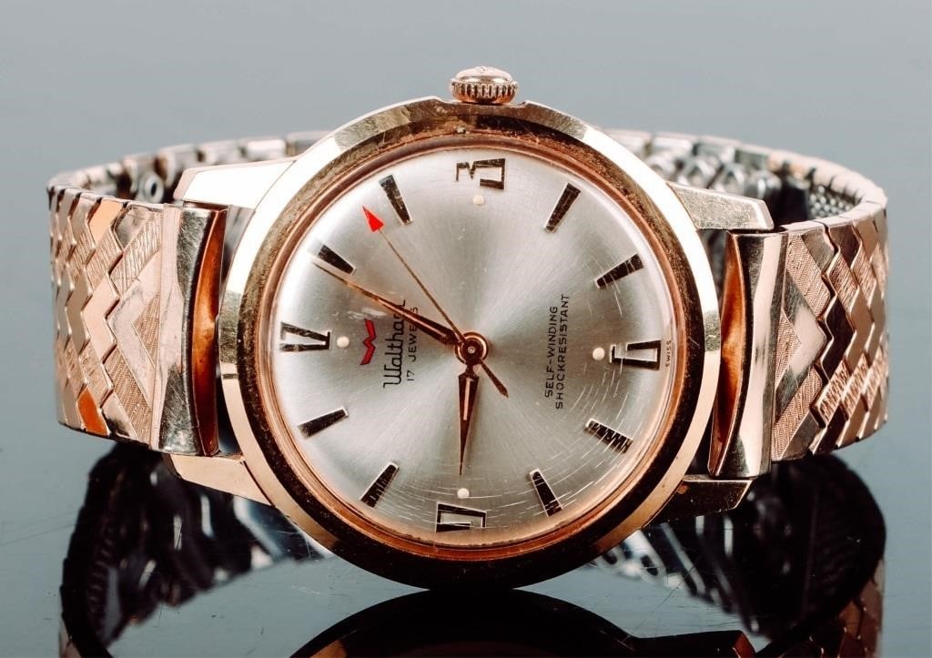 WALTHAM 17 JEWEL 18K PLATED GOLD WATCH: Waltham mens 17 jewel watch. The case is HGE18K gold plated with a stainless steel back, while the wristband is 1/20 10K gold filled with a stainless steel back and an accordian-flex. Waltham Mens Wei