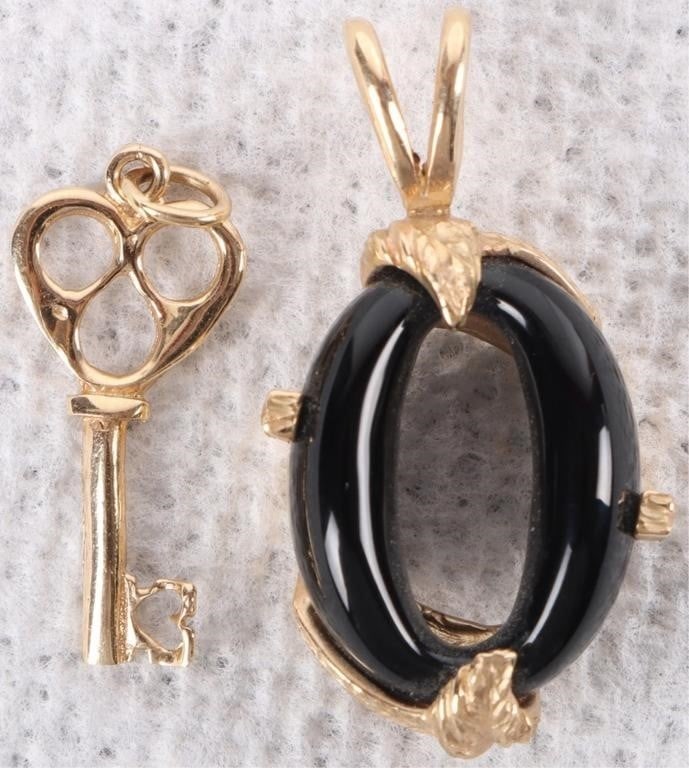 TWO 14K YELLOW GOLD LADIES PENDANTS KEY & ONYX: Lot of two 14K yellow gold ladies pendants. One is in the shape of a key and the other is an onyx oval held by leaf-shaped projections of gold. Stone Type: Onyx Weight: 5.16 Grams Size: 1" and 1.25" t