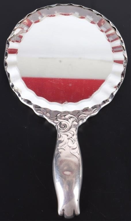 WHITING & THEODORE B. STARR STERLING MIRROR: Antique Whiting sterling silver and Theodore B. Starr ladies vanity mirror.Weight: 330.8 GramsSize: 10" LengthCondition: Wear commensurate with age.