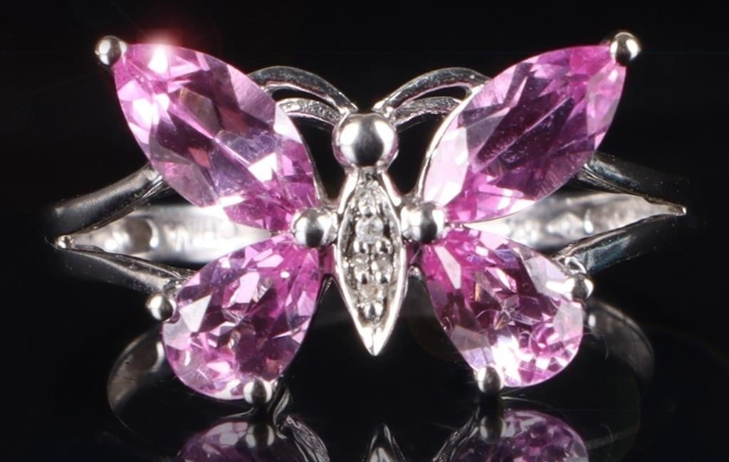 10K WHITE GOLD BUTTERFLY RING W/ DIAMONDS SAPPHIRE: 10k white gold ladies ring with a butterfly molded on the face. The top two wings are made of .45ct marquise cut pink sapphire gemstones, the bottom two are 0.3ct pear cut gemstones. and the thorax ha