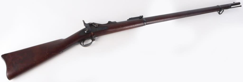 SPRINGFIELD 1884 TRAPDOOR US RIFLE: Springfield 1884 Trapdoor US rifle. Carving on the side reads "SMP 1889", indicating the manufacture date. Serial no. 446065. Carving on the butt reads "24". Original caliber was .45/70FFL, unknown if