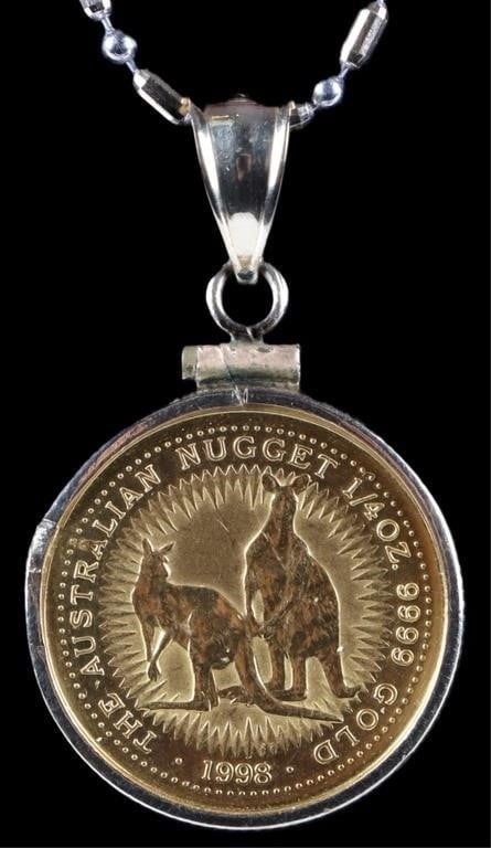 14K YELLOW GOLD NECKLACE W/ AUSTRALIAN $25 COIN: 14k gold ladies necklace. The chain is an alternating pattern of oblong yellow gold beads and spherical white gold beads. The pendant features an Australian $25 coin, which is 1/4 oz of .9999 gold. We