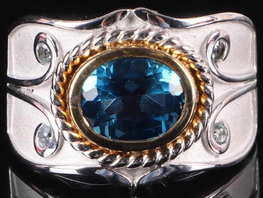 3.4CT LONDON BLUE TOPAZ & AQUAMARINE RING: 3.4CT London Blue Topaz and Aquamarine sterling silver ring. The oval blue topaz is set in a 14K yellow gold over sterling silver bezel while round aquamarines are set among scrolls of satin finished