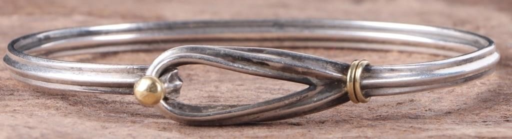 TIFFANY & CO. 0.925 & 18K GOLD HOOK & EYE BRACELET: Tiffany & Co. sterling silver & 18K yellow gold hook & eye ladies bracelet. Weight: 12.85 Grams Size: 8.50" Condition: Some wear, see images for details.