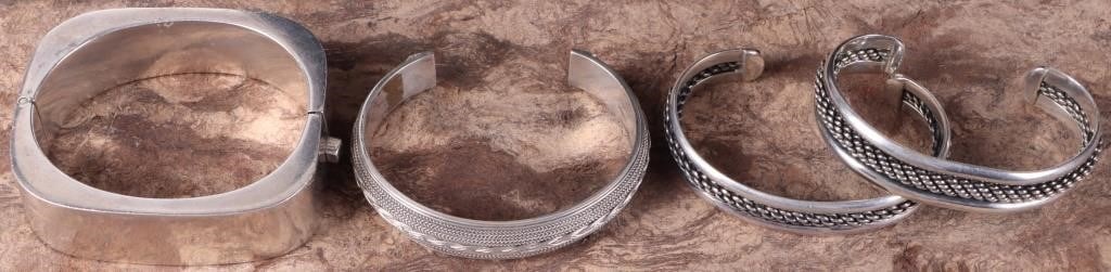 STERLING SILVER CUFF & BANGLE BRACELET LOT: Sterling silver assorted cuff and bangle bracelet lot. There are four bracelets in this lot. Three are cuff bracelets with a rope or braided design on them and the fourth is a rounded square hinged ba