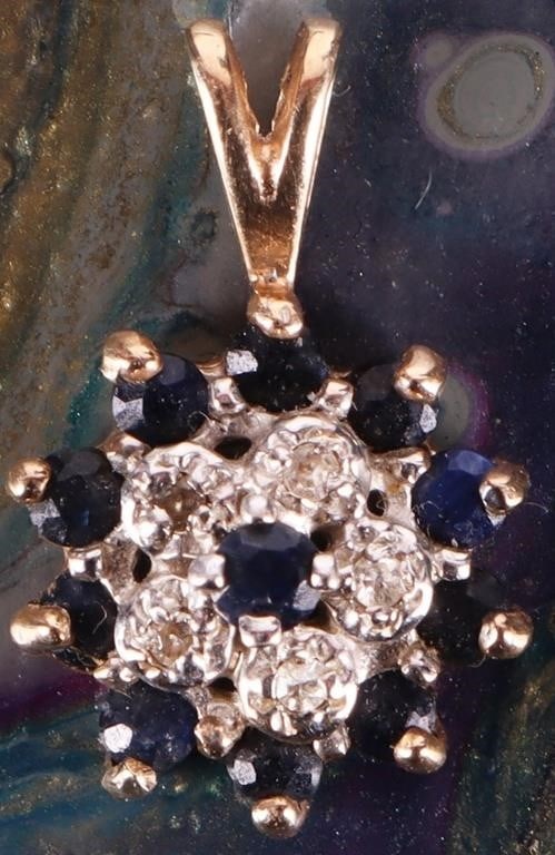14K GOLD SAPPHIRE & DIAMOND CLUSTER PENDANT: Dainty 14K yellow gold sapphire & diamond ladies cluster pendant. This cluster pendant has a halo design with the center sapphire surrounded by a row of small diamonds and another row of small sap