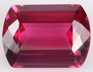 25CT BARREL FACETED MAGENTA RUBY