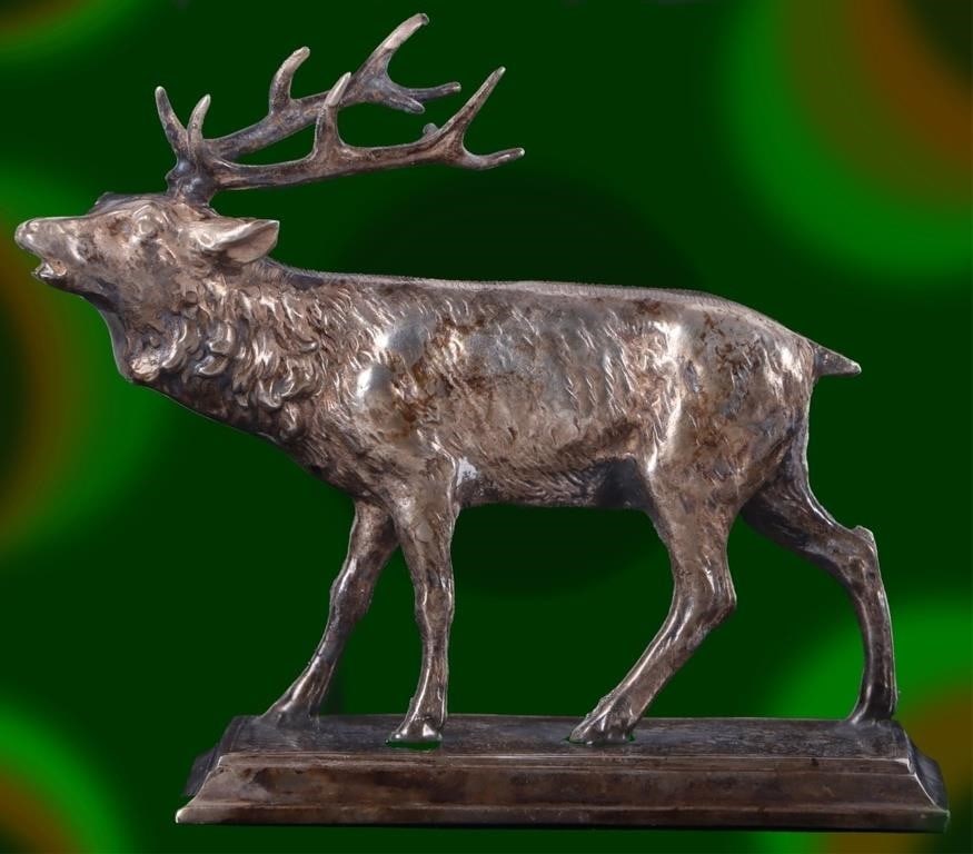 VINTAGE STERLING SILVER ELK FIGURINE WEIGHING 294G: Vintage Sterling Silver elk figurine weighing 294 grams. The figurine depicts a male elk with large antlers in a walking stance mounted on a rectangular base. Size: 5"L x 2"W x 4"H Cond