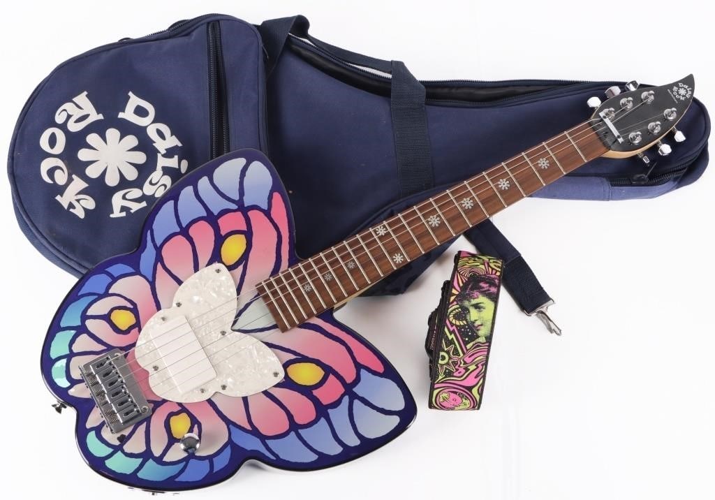 DAISY ROCK GIRLS ELECTRIC GUITAR W/ BAG & STRAP: Daisy Rock girls butterfly electric guitar with original bag and strap. 8.5 lbs. Condition: Minor chips along minor parts of the case, see pictures for more detail. Needs tuning. Musical Instruments