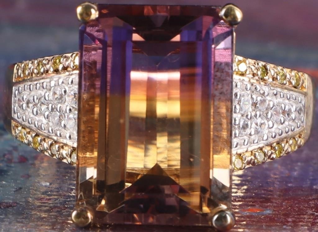 14MM EMERALD CUT BICOLOR AMETRINE & DIAMOND RING: Bicolor Ametrine and diamond ladies ring set in gold tone sterling silver. The center stone is a 14MM bicolor Ametrine. It is a naturally occurring variety of quartz that uniquely combines the purple