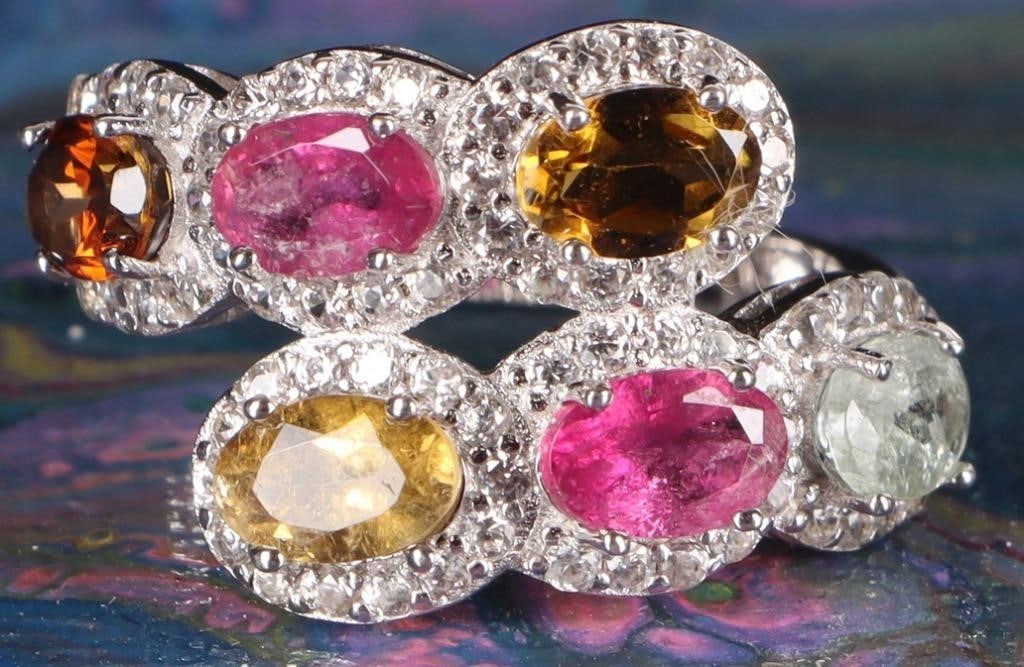 STERLING SILVER LADIES RING W/ TOURMALINE GEMS: Sterling silver ladies ring with six tourmaline gemstones of different colors (white, pink, yellow, orange, dark pink, dark yellow).Stone Type: TourmalineSize: US 6.25Condition: See pictures.