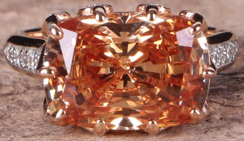 ROSE GOLD-TONE STERLING SILVER LADIES RING W/ TOUR: Rose gold-tone sterling sliver ladies ring with a 7.72ct cushion-cut orange tourmaline gemstone with cubic zirconium accessory stones on the gallery and shoulders.Stone Type: TourmalineSize: US 6.25Co