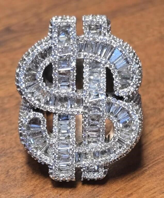 MEN'S 11CTW NATURAL DIAMOND 10K CASH SYMBOL RING: ~11CTW natural diamond 10k white gold cash symbol men's ring.Stone Type: DiamondWeight: ~42 GramsCondition: missing a single .01ct stone near the back bottom.