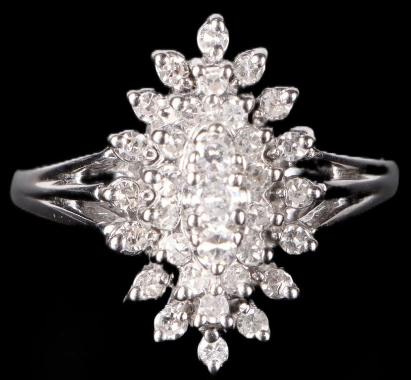 BRILLIANT 33 DIAMONDS 14K WHITE GOLD LADIES RING: Brilliant 14k white gold ladies ring with thirty 0.01ct diamonds, two 0.03ct diamonds, and one 0.05ct diamond on its face.Stone Type: DiamondWeight: 4.97 gramsSize: US 6.5Condition: See pictures.