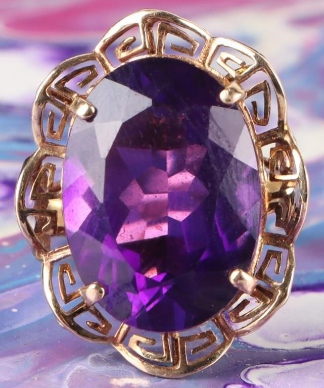 14K YELLOW GOLD 18.21MM AMETHYST LADIES RING: 14K yellow gold 18.21mm amethyst ladies ring. Gemstones to include one 18.21mm X 13.13mm oval cut amethyst.Stone Type: AmethystWeight: 5.41 GramsSize: 7.50 U.S.Condition: Little to no wear, see images
