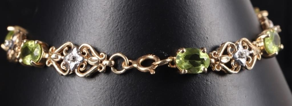 14K YELLOW GOLD PERIDOT DIAMOND LADIES BRACELET: 14K yellow gold peridot diamond ladies bracelet. Gemstones to include seven 0.50ct oval cut peridot and seven 0.01ct round cut diamonds.Stone Type: AssortedWeight: 8.11 GramsSize: 7.00"Condition: