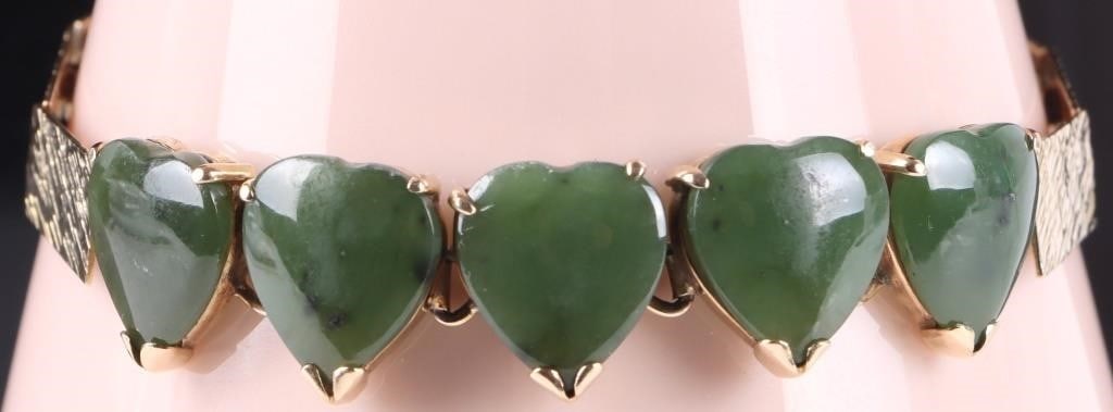 14K YELLOW GOLD SPINACH JADE HEART LADIES BRACELET: 14K yellow gold spinach Jade heart ladies bracelet. The band on this bracelet is made of interlocking panels creating a unique design. There are five spinach Jade hearts in the center of the
