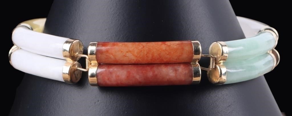 14K YELLOW GOLD LADIES BRACELET W/ COLORED JADE: 14k yellow gold ladies bracelet with six links made of multiple colors of stone. The opaque white, green, red, solid white, and yellow stones are jade and the black stone is onyx. The clasp features