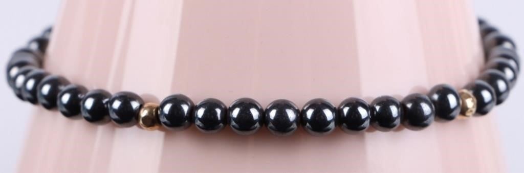 14K YELLOW GOLD HEMATITE BEADED LADIES BRACELET: 14K yellow gold hematite beaded ladies bracelet.Weight: 6.06 gramsSize: 6" lengthCondition: Very fine, please see image.