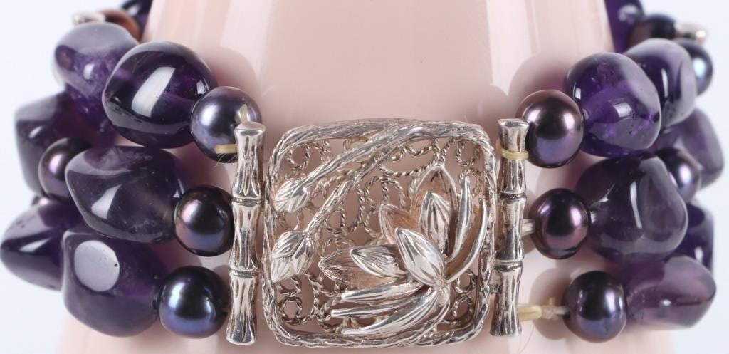 STERLING SILVER AMETHYST & PEARL BEADED BRACELET: Sterling silver amethyst & pearl beaded ladies bracelet with deep purple 7.0-6.0mm pearls.Stone Type: AssortedWeight: 62.07 GramsSize: 7.0" LengthCondition: Like new qualities.
