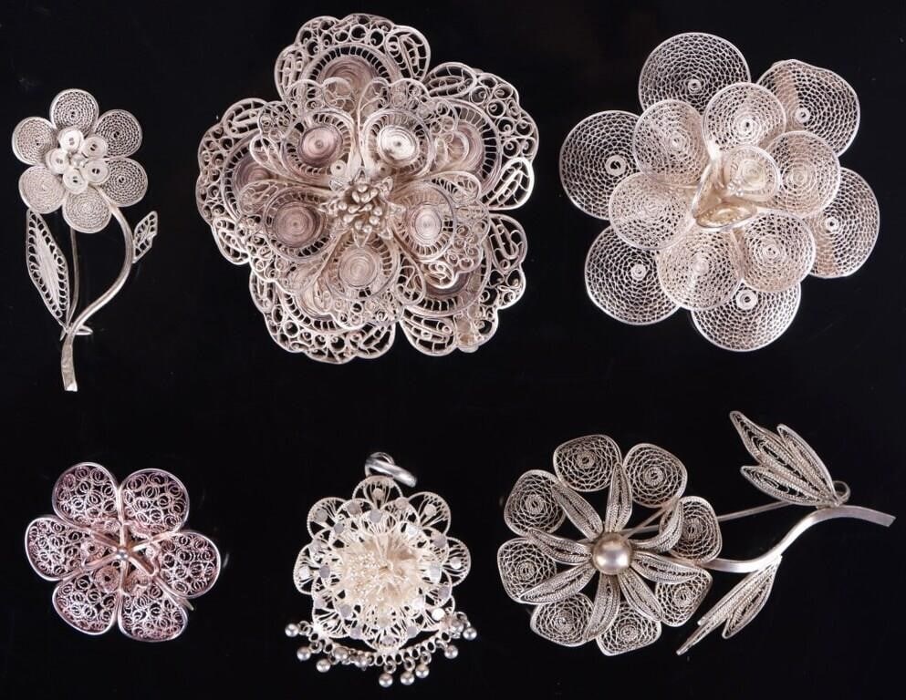 ANTIQUE FILIGREE STERLING SILVER FLORAL BROOCHES: Antique filigree sterling silver floral ladies brooches. Lot of 6. These pieces have thousands of details and intricacies.Weight: 49.34 GramsSize: 2.25" lengthCondition: Some tarnishing, see images.