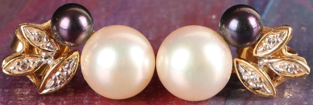 18K YELLOW GOLD PEARL AND DIAMOND STUD EARRINGS: 18K yellow gold pearl and diamond ladies stud earrings. The design features a cluster of gold leaf shapes that are adorned with small round cut diamonds. The earrings are set with two pearls, one is a