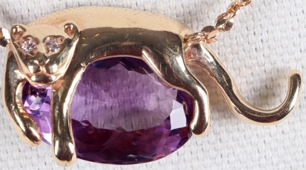 14K YELLOW GOLD LADIES PANTHER NECKLACE W/ DIAS: 14k yellow gold ladies chain necklace. The pendant features a gold panther with small diamond eyes reclining on an approximately 24ct oval-cut purple spinel gemstone.Stone Type: DiamondWeight: ~8.47 g