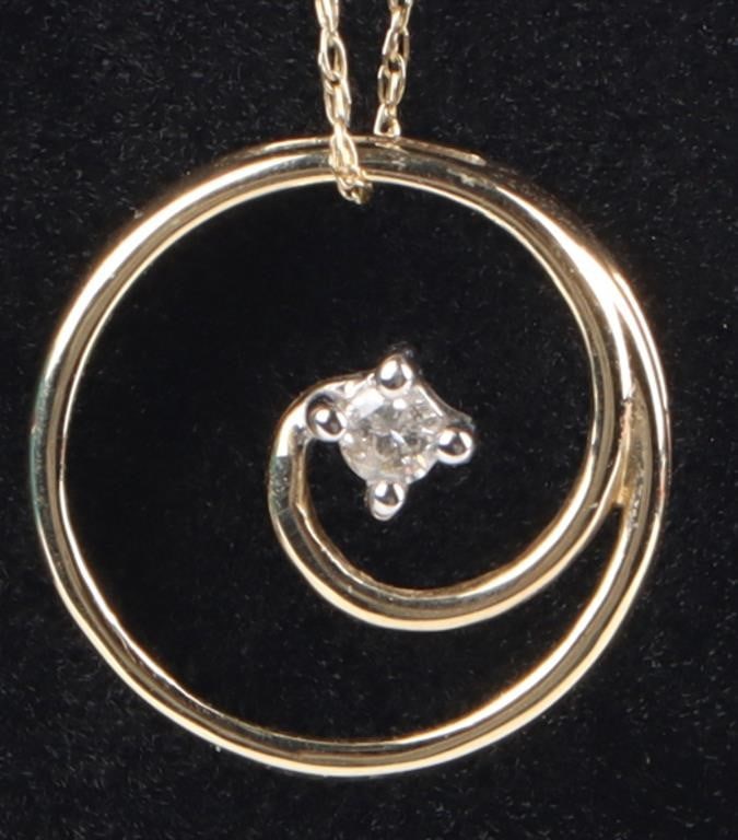 DIAMOND 10K YELLOW GOLD SPIRAL LADIES NECKLACE: Diamond 10K yellow gold spiral ladies necklace with 0.08CT round diamonds.Stone Type: DiamondSize: 18" lengthCondition: Like new.