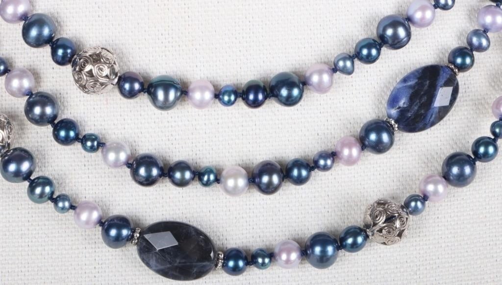 STERLING SILVER LADIES NECKLACE BLUE PEARLS: Sterling silver ladies necklace with cultured blue and indigo pearls and iolite stones.Stone Type: PearlWeight: 84.2 gramsSize: 20" longCondition: See pictures.