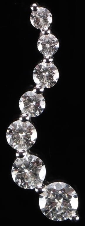 14K WHITE GOLD DIAMOND JOURNEY PENDANT: 14K white gold diamond journey pendant. This distinctive "S" or wave shape , along with the graduated sizes of the diamonds, represents the twists and turns of a life path, where each milestone adds s