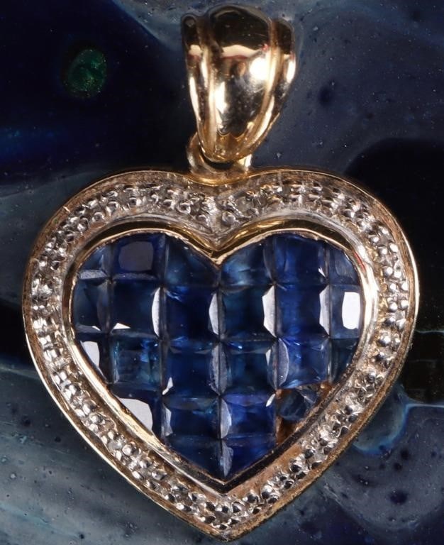 14K YELLOW GOLD LONDON TOPAZ DIAMOND HEART PENDANT: 14K yellow gold London blue topaz diamond heart ladies pendant. Gemstones to include twelve 0.10ct princess cut London Blue topaz, twelve 0.03 to 0.07ct various cut London blue topaz, and thirty-five