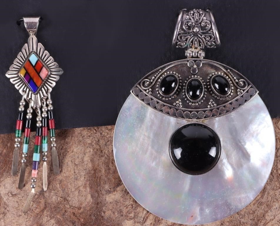 SW STYLE STERLING SILVER LADIES PENDANTS MOP (2): Lot of two sterling silver ladies pendants, one of which features a large circular mother of pearl with onyx and the other of which features multiple colorful jasper stones. Both of which are