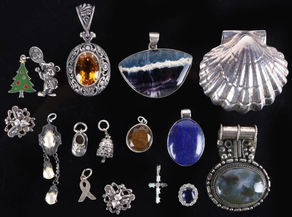 WHIMSICAL STERLING SILVER LADIES PENDANTS (16): Assorted whimsical and ornate sterling silver ladies pendants. Lot includes a large seashell, an officially-licensed Mickey Mouse figurine, a cross with opal stones, a ribbon, perhaps for breast