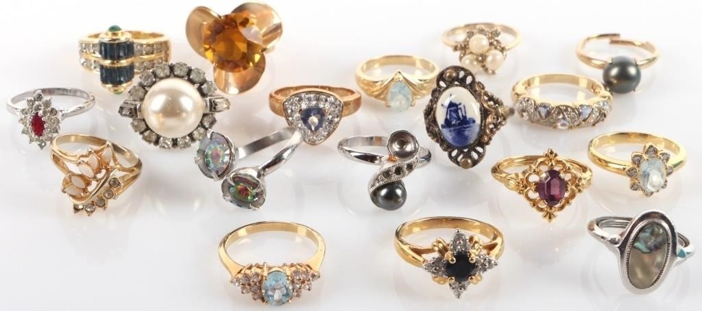 LARGE LOT LADIES RINGS W/ TOPAZ MOP ETC (18): Lot of eighteen ladies rings. Of note are three gold-toned rings with blue topaz center stones, an antique ring with a China-pottery-style illustration of a windmill, a silver-toned ring with a