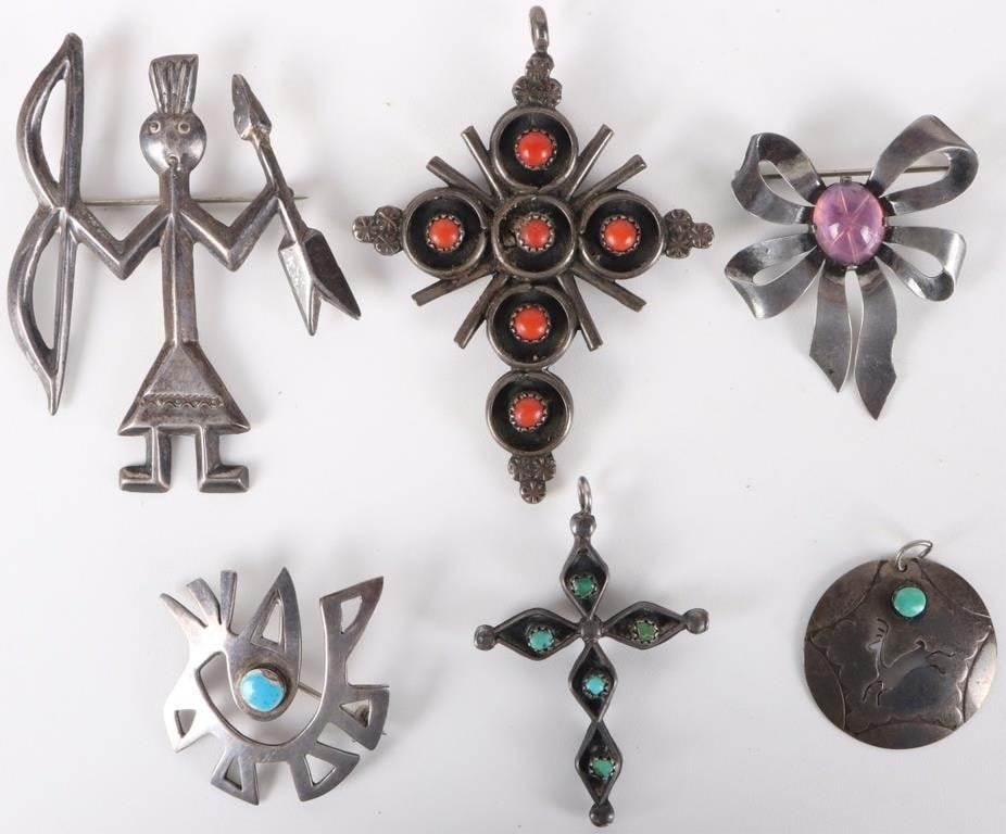 SOUTHWEST NATIVE STERLING SILVER LADIES JEWELRY: Southwest Native American sterling silver ladies jewelry to include: two turquoise and coral cross ladies pendants, one bow pink star brooch, one turquoise deer pendant, one Peru sterling silver
