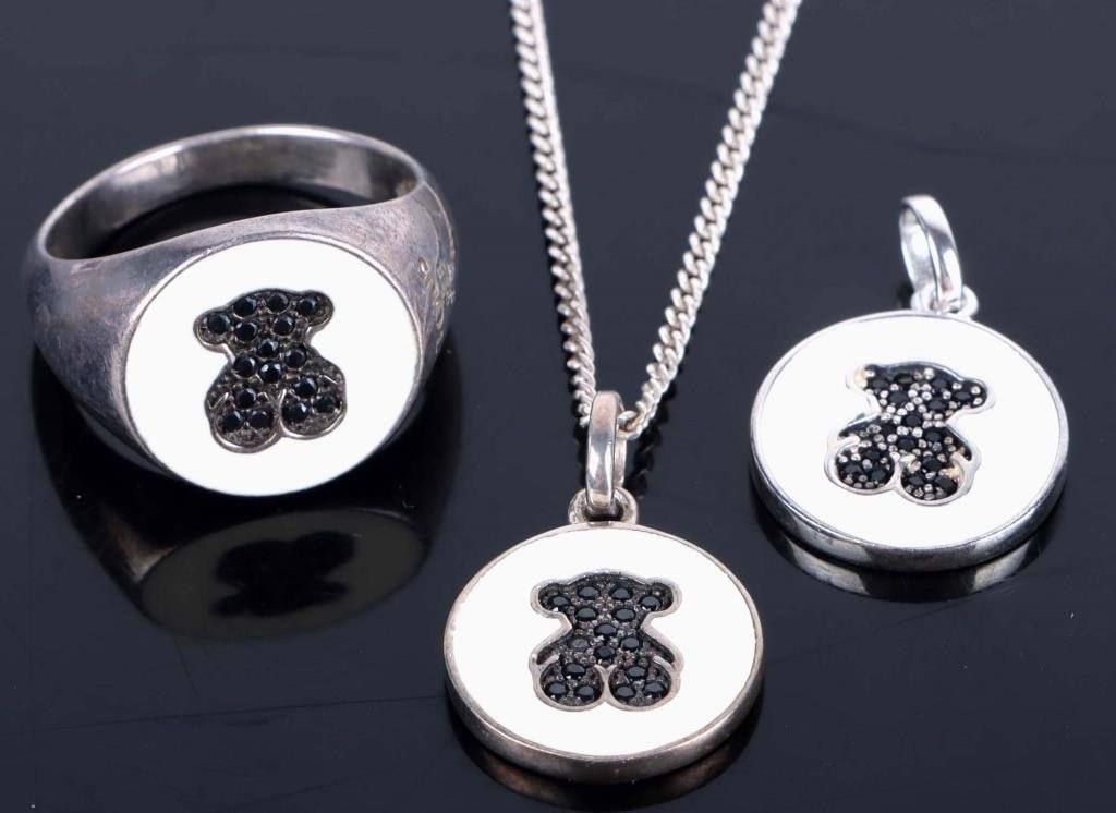 TOUS DESIGNER BEAR STERLING SILVER MATCHING SET: Tous designer bear sterling silver matching set. This set includes one ring, one charm and one necklace. Set has white painted enamel and black gemstone.Stone Type: AssortedWeight: 11.00 gramsSize: