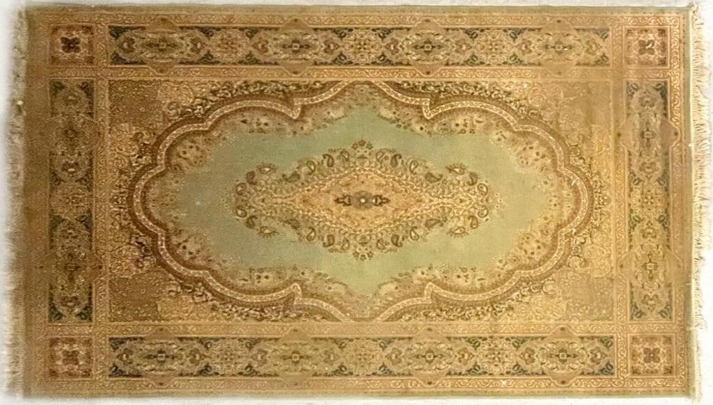 LARGE ORNATE PERSIAN HAND-KNOTTED AREA RUG: Large ornate Persian hand-knotted area rug with red yellow and green accents. Rug measures ~79" X 102" Rug has tassels on two ends.Size: 79" X 102"Condition: Wear commensurate with age. Needs