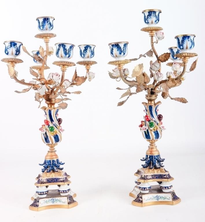 ANTIQUE HAND CRAFTED PORCELAIN CANDELABRA PAIR: Antique hand-crafted porcelain candelabra pair. To feature ornate and finely detailed porcelain flowers and leaves depicting a candelabra that looks like a gorgeous flower bushel.Size: 18"