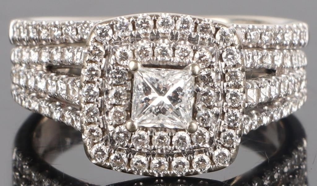 14K WHITE GOLD NATURAL DIAMOND LADIES RING: 14K white gold natural diamond ladies ring. Gemstones to include one-hundred-five 0.01ct round cut natural diamonds, two 0.02ct round cut natural diamonds, and one 0.40ct princess cut natural diamond.