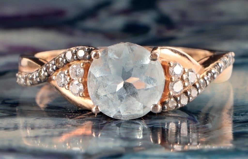 14K YELLOW GOLD AQUAMARINE DIAMOND LADIES RING: 14K yellow gold aquamarine diamond ladies ring. Gemstones to include one 1.50ct round cut aquamarine, eight 0.02ct round cut diamonds, and eighteen 0.01ct round cut diamonds.Stone Type: AssortedWeight