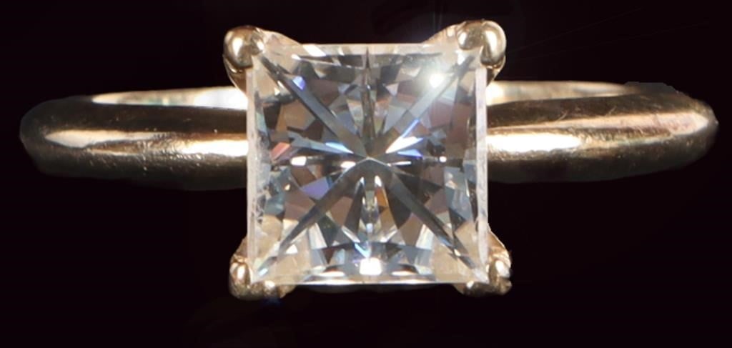 1.5CT PRINCESS CUT MOISSANITE ENGAGEMENT RING: 1.5CT princess cut moissanite solitaire engagement ring set in 14K yellow gold.Stone Type: MoissoniteWeight: 3.80 GramsSize: US 7.0Condition: Slight surface scratches on band from normal wear. See ima