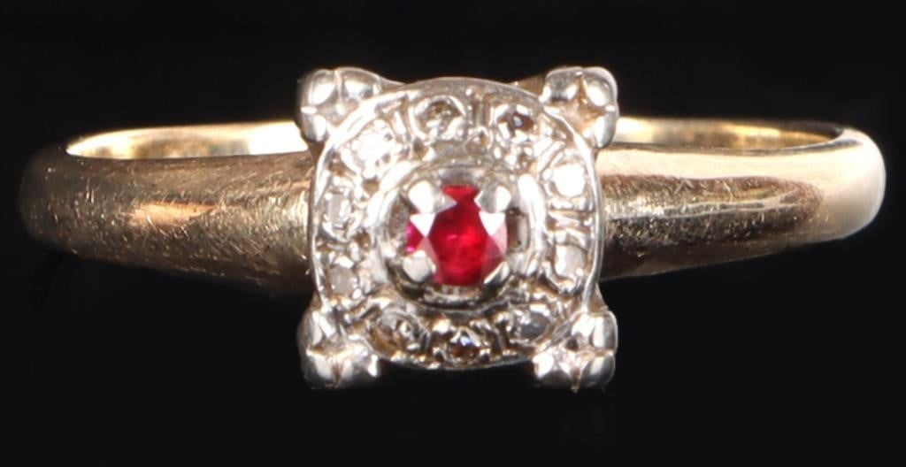 VINTAGE 14K RUBY & DIAMOND HALO LADIES RING: Vintage 14K yellow gold ruby and diamond halo ladies ring. The ring features a central, round cut red ruby that is surrounded by a halo of white diamonds. It features a distinctive square shaped setti