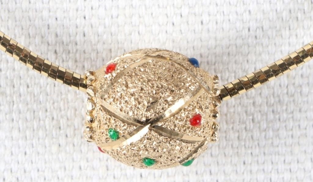 10K YELLOW GOLD BEADED PENDANT & NECKLACE: 10K yellow gold beaded pendant necklace. Necklace has one egg-shaped bead with colored enameled spotted paint.Weight: 9.41 GramsSize: 16" lengthCondition: Chain has some wear, see images.