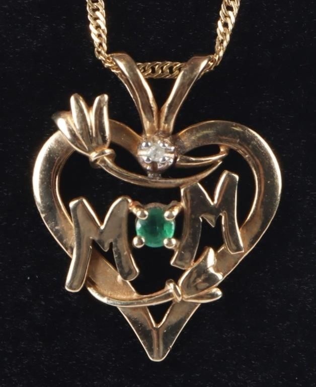 14K YELLOW GOLD EMERALD DIAMOND LADIES NECKALCE: 14K yellow gold emerald diamond ladies necklace with one 0.01CT round diamond and one 0.03CT round emerald. necklace says "MOM."Stone Type: AssortedWeight: 2.87 GramsSize: 20" LengthCondition: Very fi