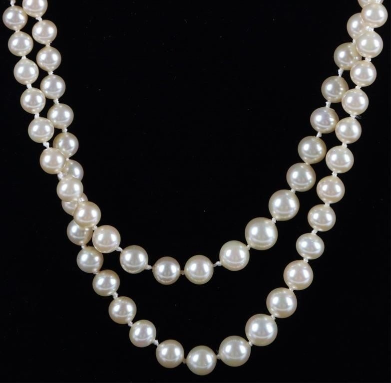 DOUBLE STRAND FAUX PEARL LADIES NECKLACE: Double strand faux pearl ladies necklace with a 14K yellow gold clasp. This double strand necklace has one strand slightly longer than the other creating a layer effect. The pearls are a soft cream co
