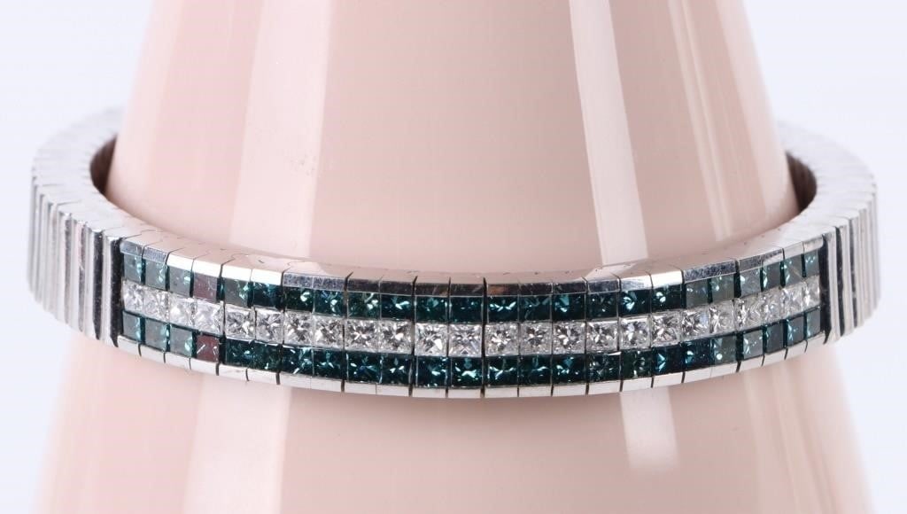 2.4CTW NATURAL BLUE & WHITE 14K DIAMOND BRACELET: 2.4CTW natural blue & white diamond 14K white gold bracelet.Stone Type: DiamondWeight: 48.69 GramsSize: 7"Condition: Very fine