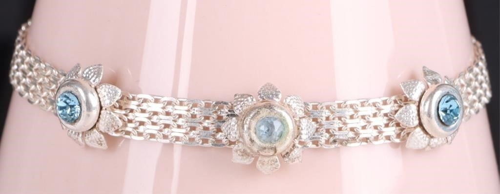 STERLING SILVER TOPAZ FLOWER LADIES BRACELET: Sterling silver topaz flower ladies bracelet. to include a beautiful chain mail style interlocking chain and flower insets for each gemstone. Gemstones to include one 0.15CT round cut topaz, and two 0