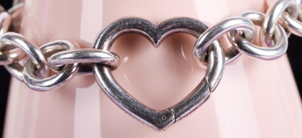 TIFFANY & CO. 0.925 LINK HEART CLASP BRACELET: Tiffany & Co. sterling silver Link Heart Clasp bracelet.Weight: 46.80 GramsSize: 7.50"Condition: Some minor wear, see images for details.