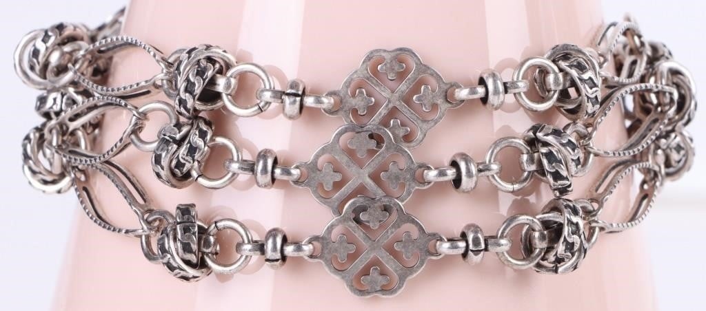 LA VIE PARISIENNE SILVER FILIGREE CHAIN BRACELET: La Vie Parisienne by Catherine Popesco silver filigree clovers triple chain bracelet.Weight: 30.52 GramsSize: 7.0"Condition: See images for complete condition.
