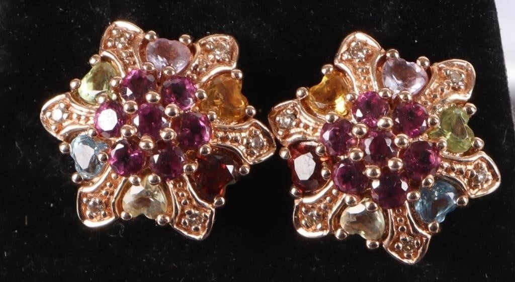 14K YELLOW GOLD LADIES EARRINGS DIAS TOPAZ PERIDOT: 14k yellow gold ladies earrings molded in a hexagonal sunburst pattern. On each corner is a melee diamond, twelve in total across both earrings. In between the corners are six approximately 0.085ct he